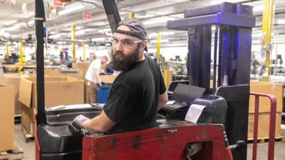 Dynamic Lifecycle Innovations employee in a forklift machine in the electronics recycling facility in Onalaska, Wisconsin.