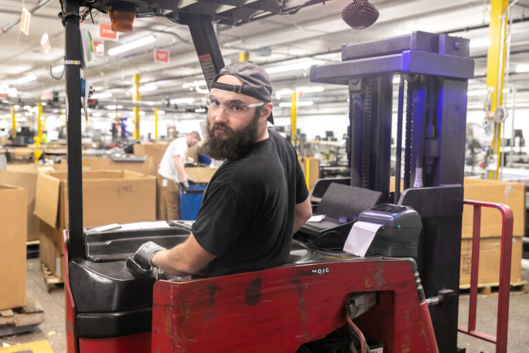 Dynamic Lifecycle Innovations employee in a forklift machine in the electronics recycling facility in Onalaska, Wisconsin.