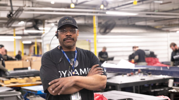 Dynamic Lifecycle Innovations employee in the electronics recycling facility.