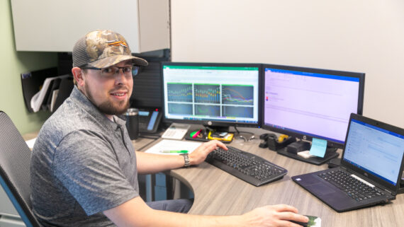 Dynamic Lifecycle Innovations employee working at his desk.