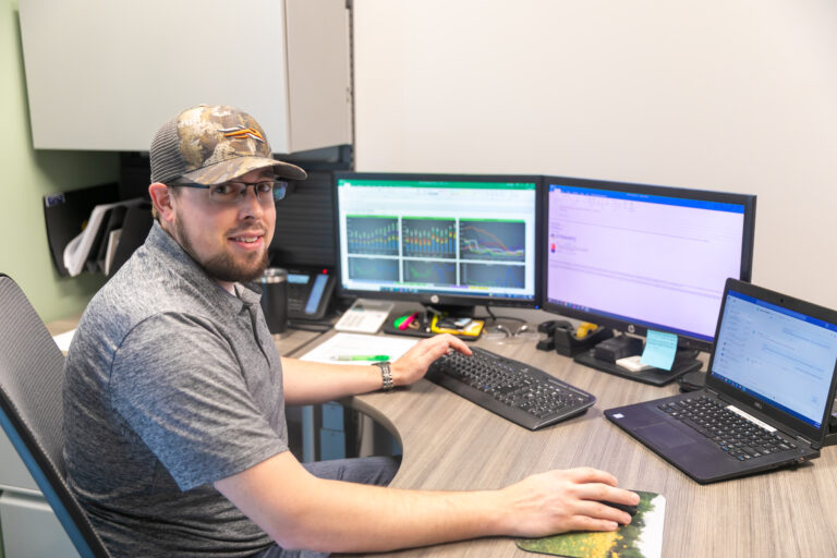 Dynamic Lifecycle Innovations employee working at his desk.