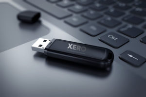 USB drive with Xero logo on side