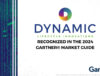 A graphic that includes the Dynamic Lifecycle Innovations logo with text: 'Recognized in the 2024 Gartner® Market Guide,' alongside a digital background featuring green data lines and the Gartner® logo at the bottom right.