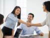 Women shaking hands with each other at an introduction meeting.