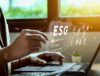 Environmental, Social, Global (ESG) icons floating above a man working on a laptop.