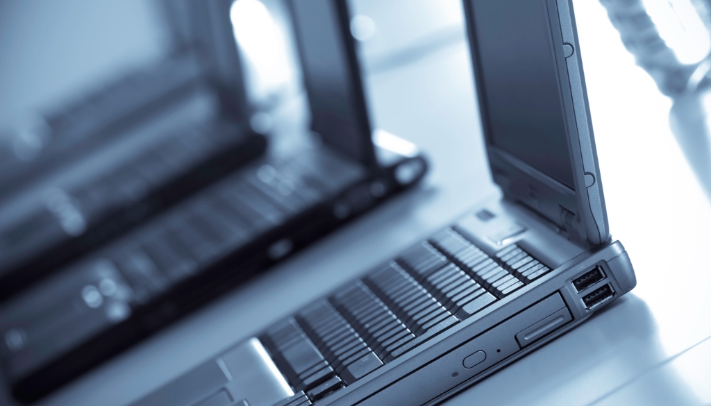 Company laptops lined up to be sent to a remote workforce.