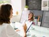 Woman conducting a virtual interview while working from home during the Covid-19 pandemic.