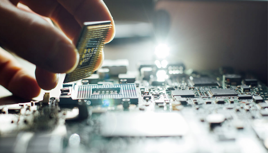 Person holding a computer chip.